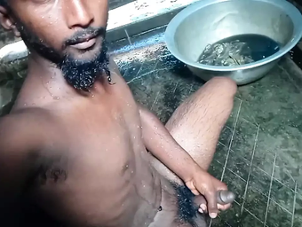 Watch this kinky Indian grandpa fuck a young stud in a steamy shower