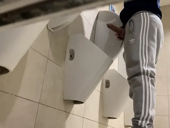 Watch as two straight guys get caught tugging in public rest room - it's a hot, steamy public cumshot!