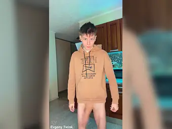 Watch Evgeny Twink's skinny body take a huge cum load after a steamy workout session