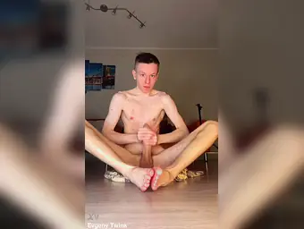 Watch skinny young Evgeny Twink get a big load out of his fat uncensored cock